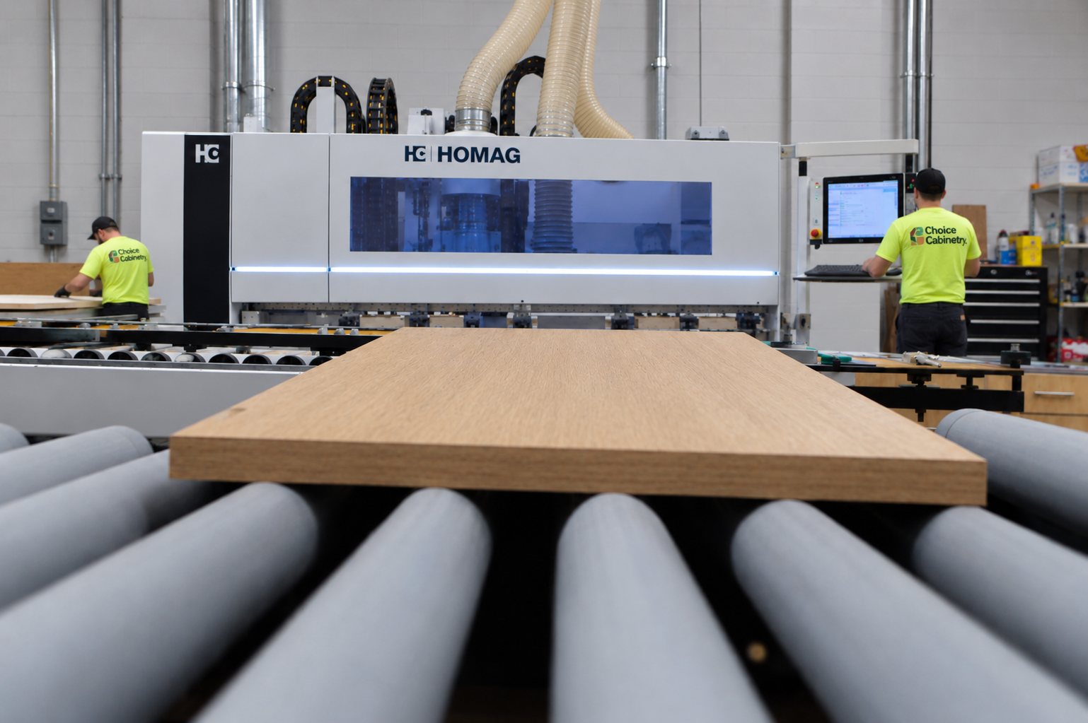 A panel leaving the HOMAG machining center on the roller conveyor